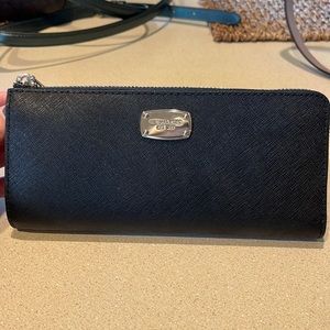 Brand: Michael Kors. Color: Black. Size: 8” (L), 3 1/2” (H)